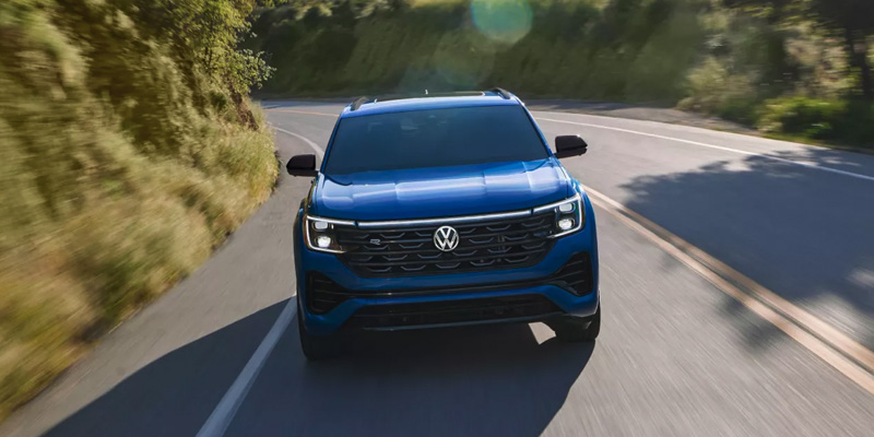 Blue Volkswagen Atlas on road