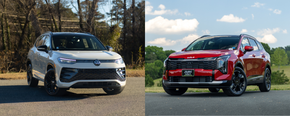 New Volkswagen Tiguan next to a new Kia Sportage. Both cars are parked outside.